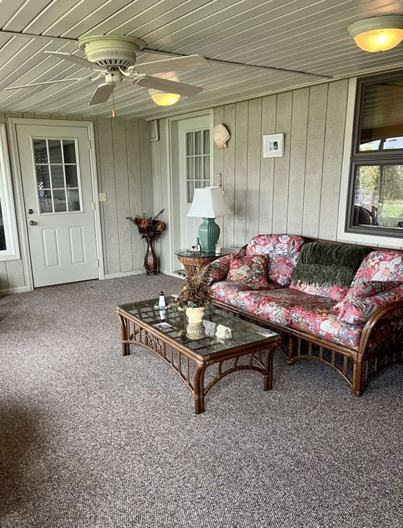 57 Chestnut Circle Suffield, CT 06093 - Photo 35 of 40 a living room with furniture and a chandelier