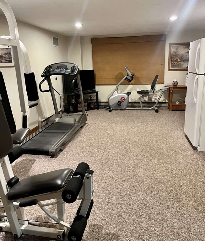 57 Chestnut Circle Suffield, CT 06093 - Photo 38 of 40 a living room with furniture and a flat screen tv