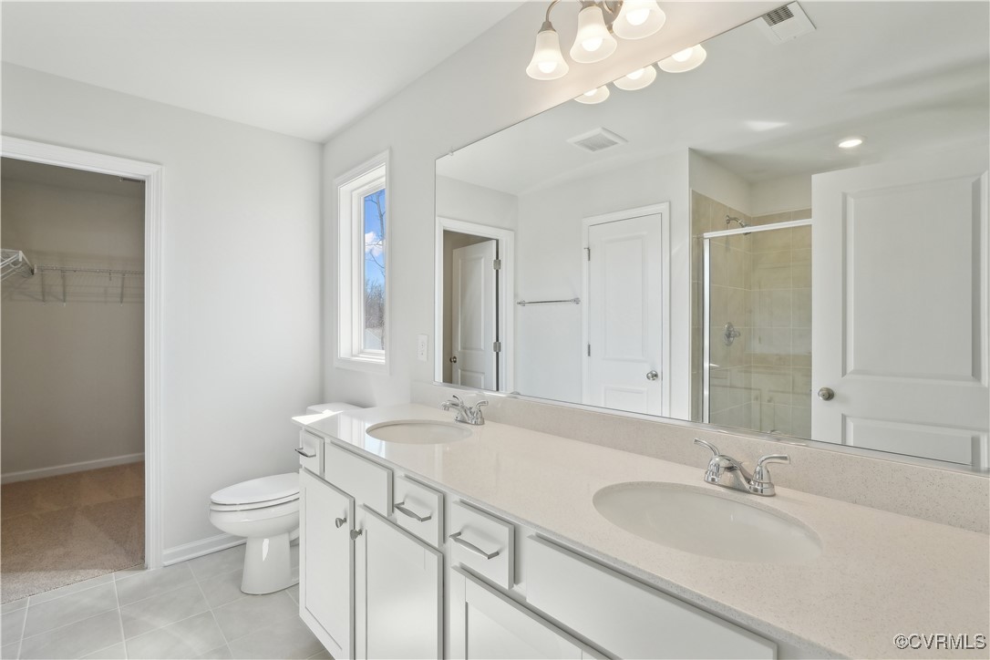 229 Bellevue Circle Aylett, VA 23009 - Photo 12 of 18 a bathroom with a granite countertop sink a toilet and a mirror