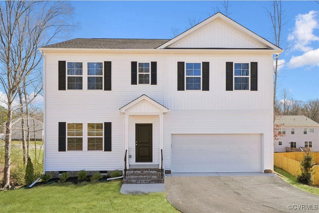 229 Bellevue Circle Aylett, VA 23009 - Photo 18 of 18 a front view of a house with a yard