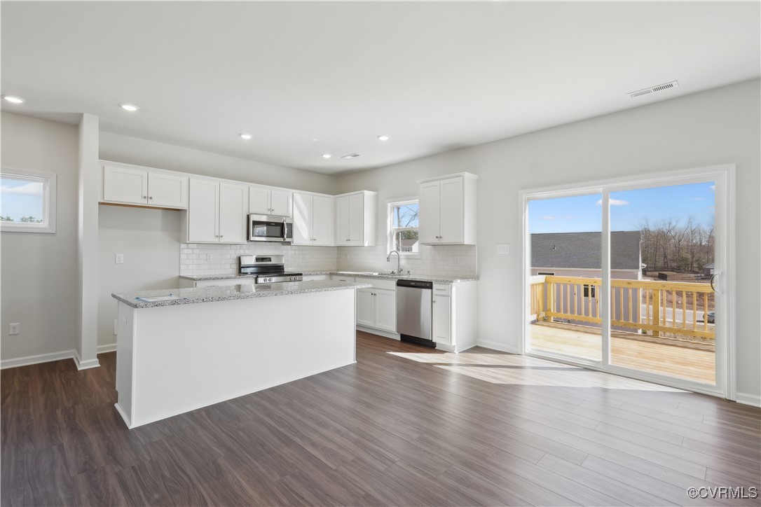 229 Bellevue Circle Aylett, VA 23009 - Photo 2 of 18 a kitchen with a refrigerator and white cabinets