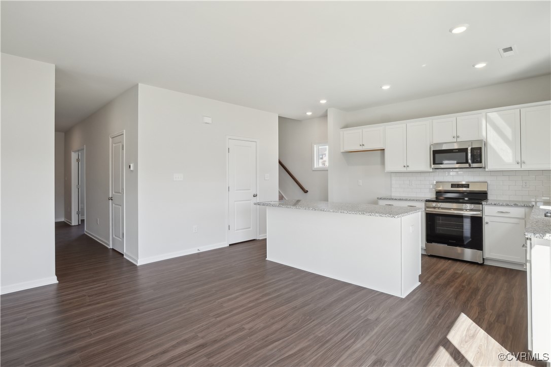 229 Bellevue Circle Aylett, VA 23009 - Photo 3 of 18 a kitchen with wooden floors and white appliances
