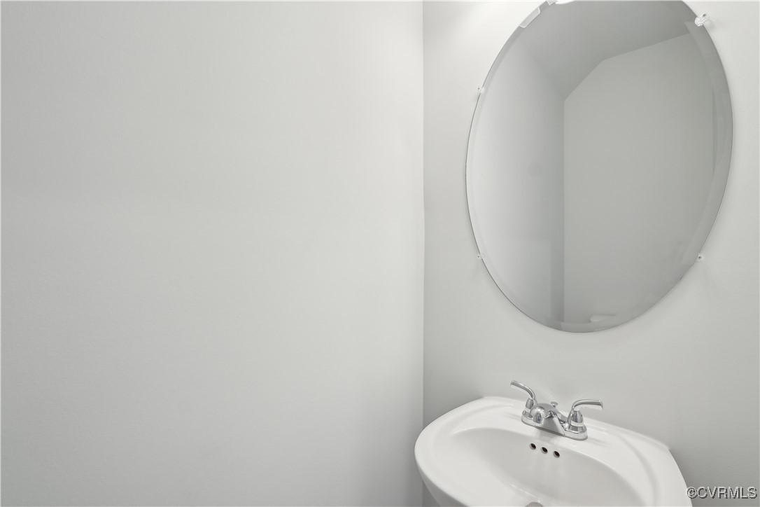 229 Bellevue Circle Aylett, VA 23009 - Photo 8 of 18 a bathroom with a sink and a mirror