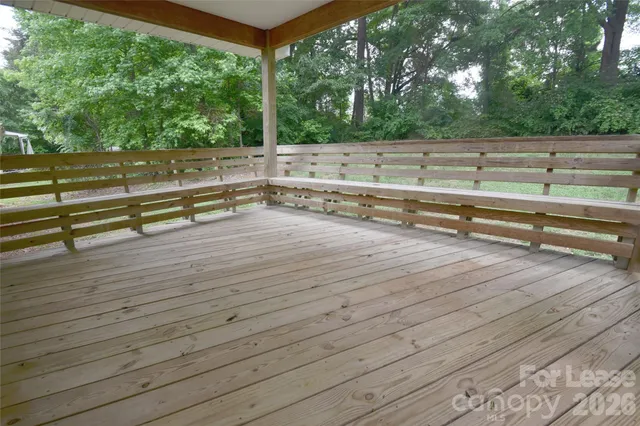 a view of outdoor space with deck and yard