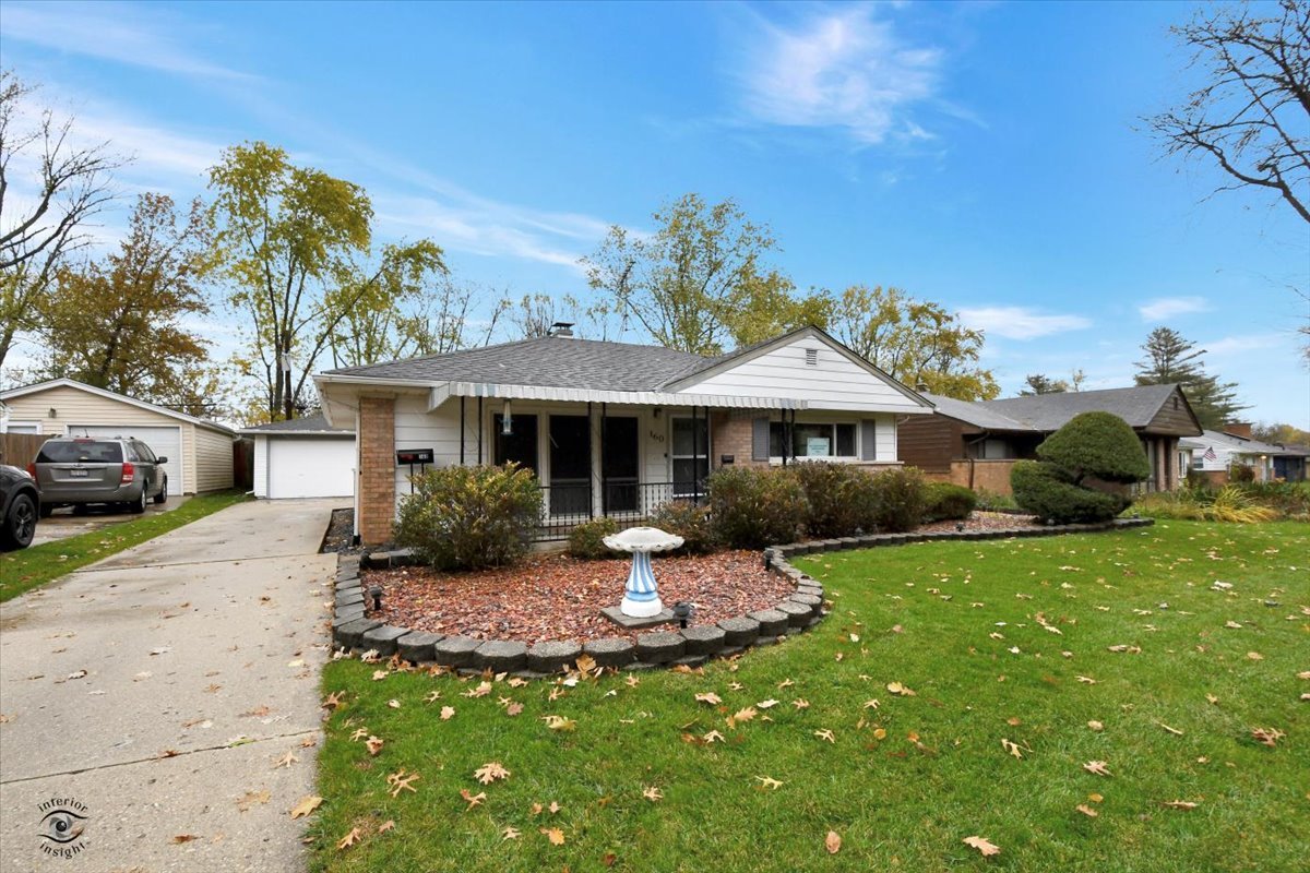 160 Monee Road Park Forest, IL 60466 - Photo 1 of 24 a front view of a house with a yard
