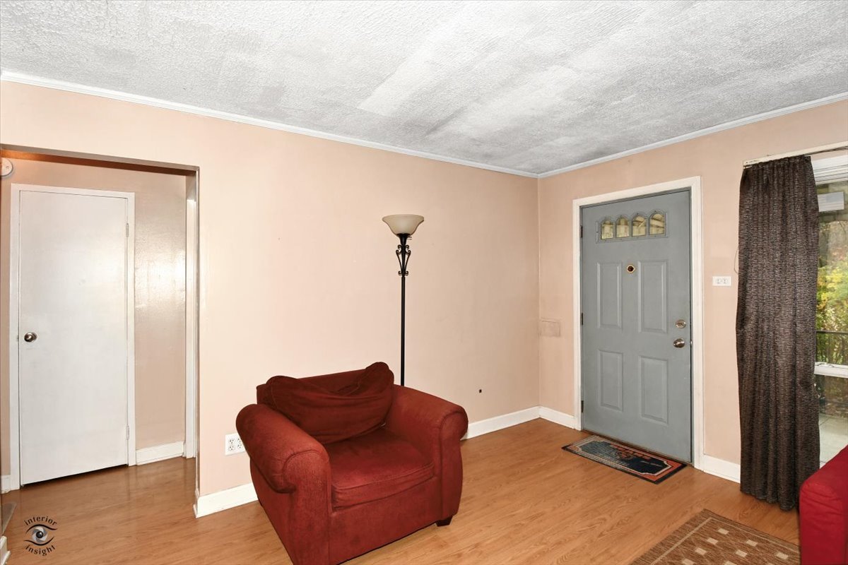 160 Monee Road Park Forest, IL 60466 - Photo 3 of 24 a bedroom with a bed and a couch