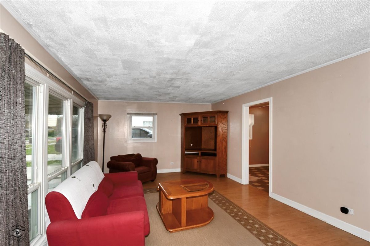 160 Monee Road Park Forest, IL 60466 - Photo 4 of 24 a living room with furniture and a window