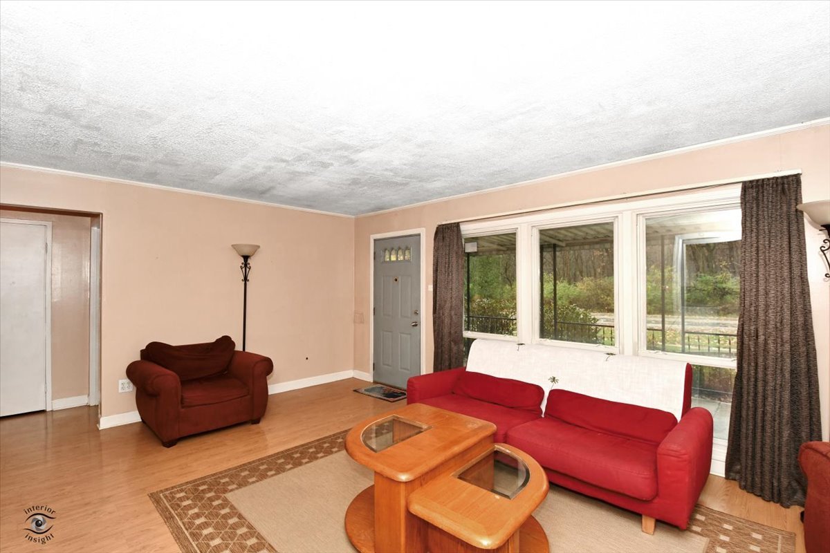 160 Monee Road Park Forest, IL 60466 - Photo 5 of 24 a living room with furniture and a floor to ceiling window