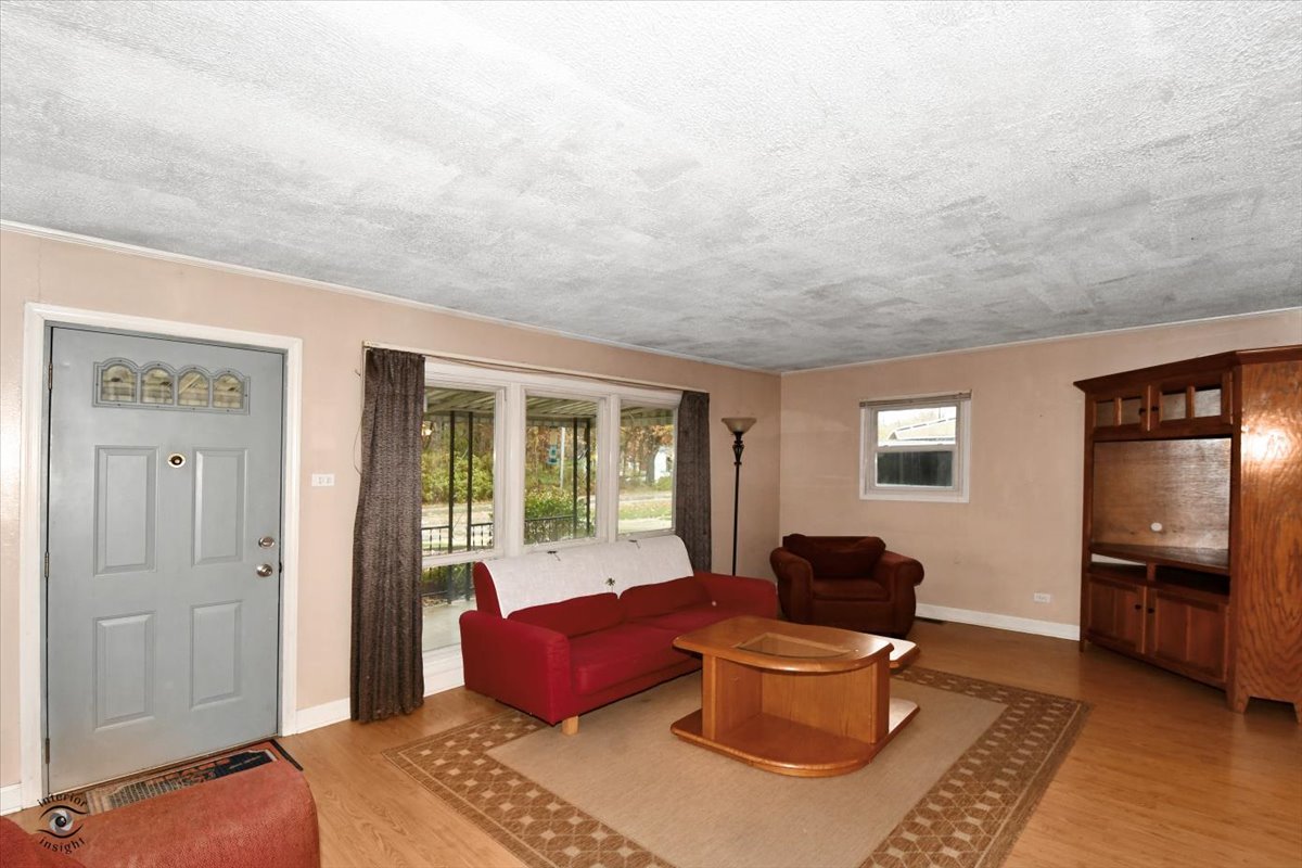 160 Monee Road Park Forest, IL 60466 - Photo 6 of 24 a living room with furniture and a window