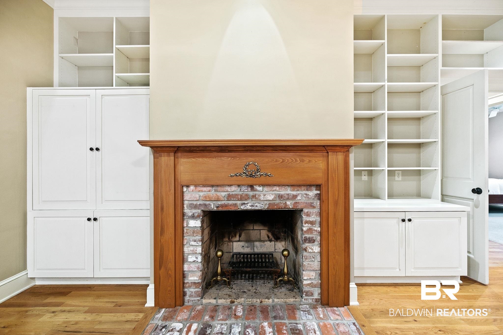 202 Beall Lane Daphne, AL 36526 - Photo 10 of 46 Details with a brick fireplace and hardwood / wood-style flooring