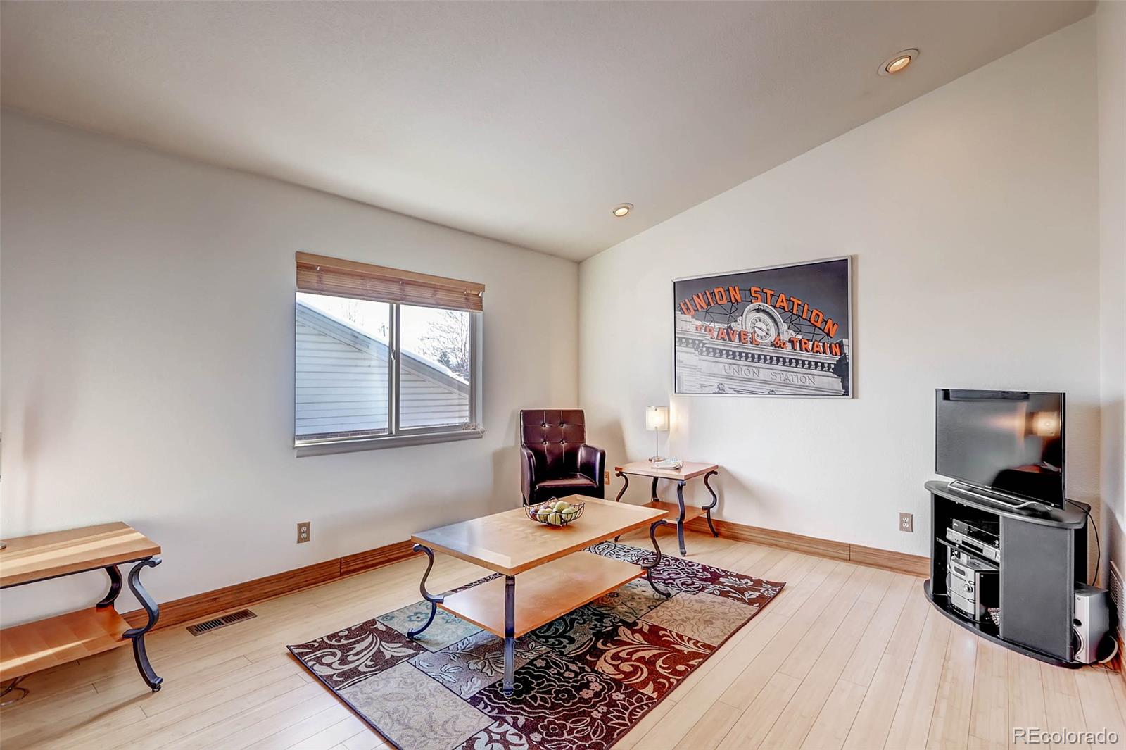 965 Wolff Street, Unit A Denver, CO 80204 - Photo 11 of 34 a living room with furniture and a flat screen tv