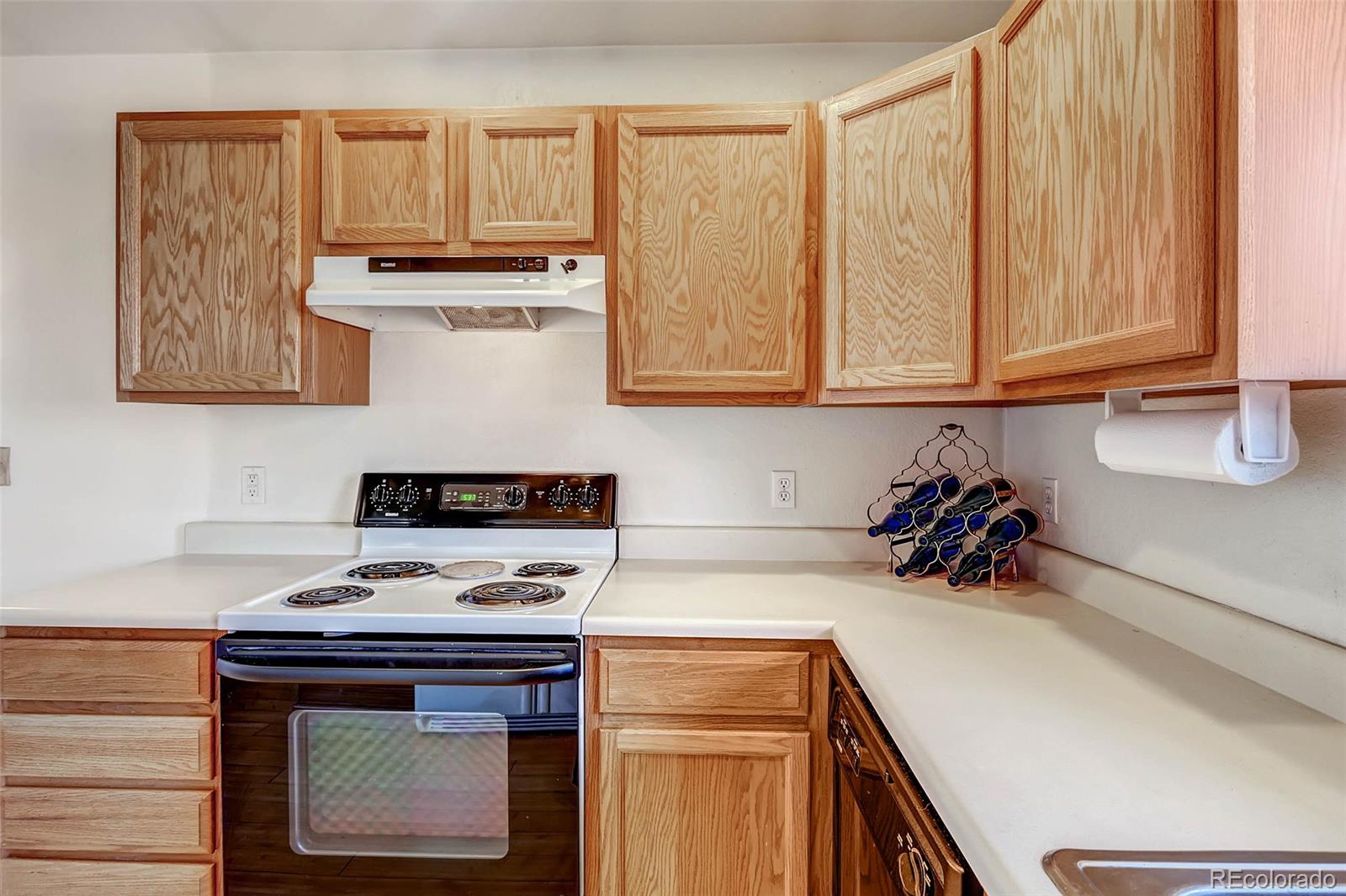 965 Wolff Street, Unit A Denver, CO 80204 - Photo 12 of 34 a kitchen with stainless steel appliances a stove a sink and cabinets