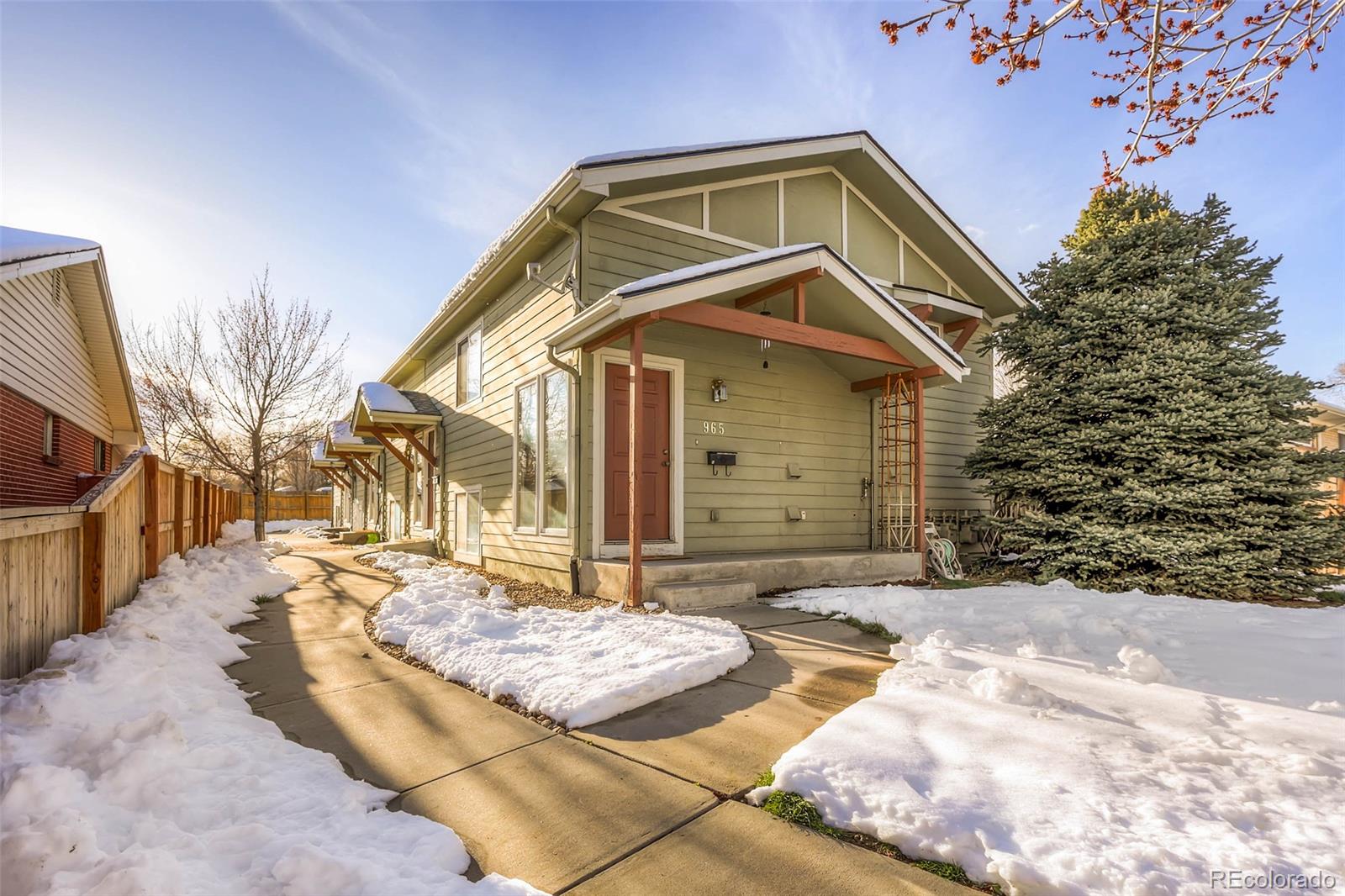 965 Wolff Street, Unit A Denver, CO 80204 - Photo 20 of 34 a front view of a house with a yard