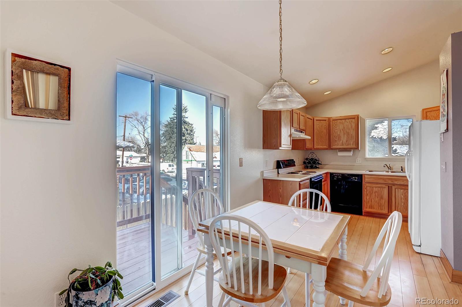 965 Wolff Street, Unit A Denver, CO 80204 - Photo 21 of 34 a view of a dining room with furniture window and wooden floor