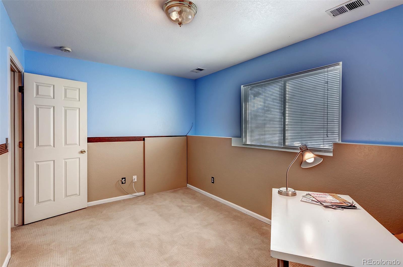 965 Wolff Street, Unit A Denver, CO 80204 - Photo 23 of 34 an empty room with a window