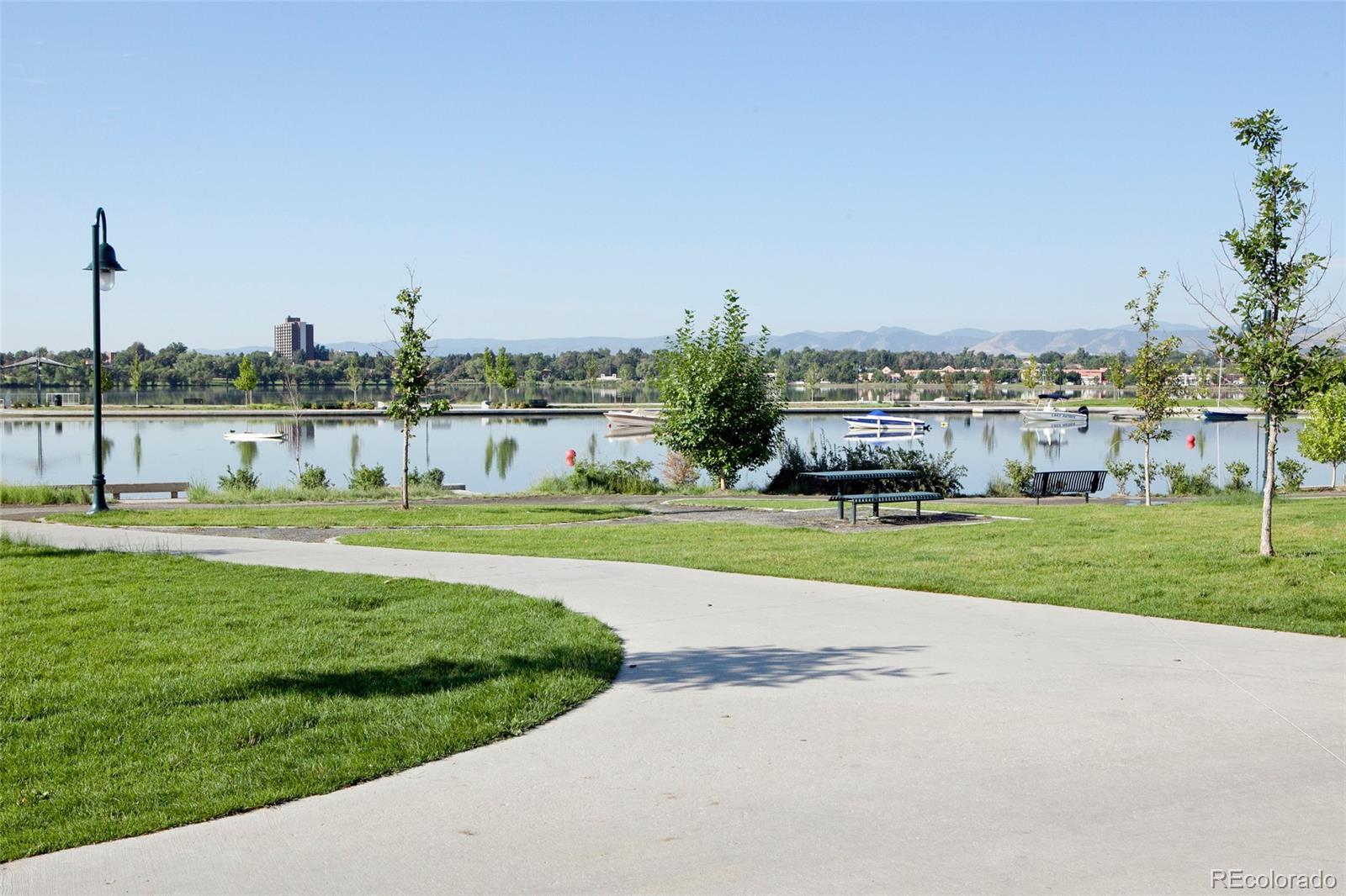 965 Wolff Street, Unit A Denver, CO 80204 - Photo 29 of 34 a view of a garden with a building in the background