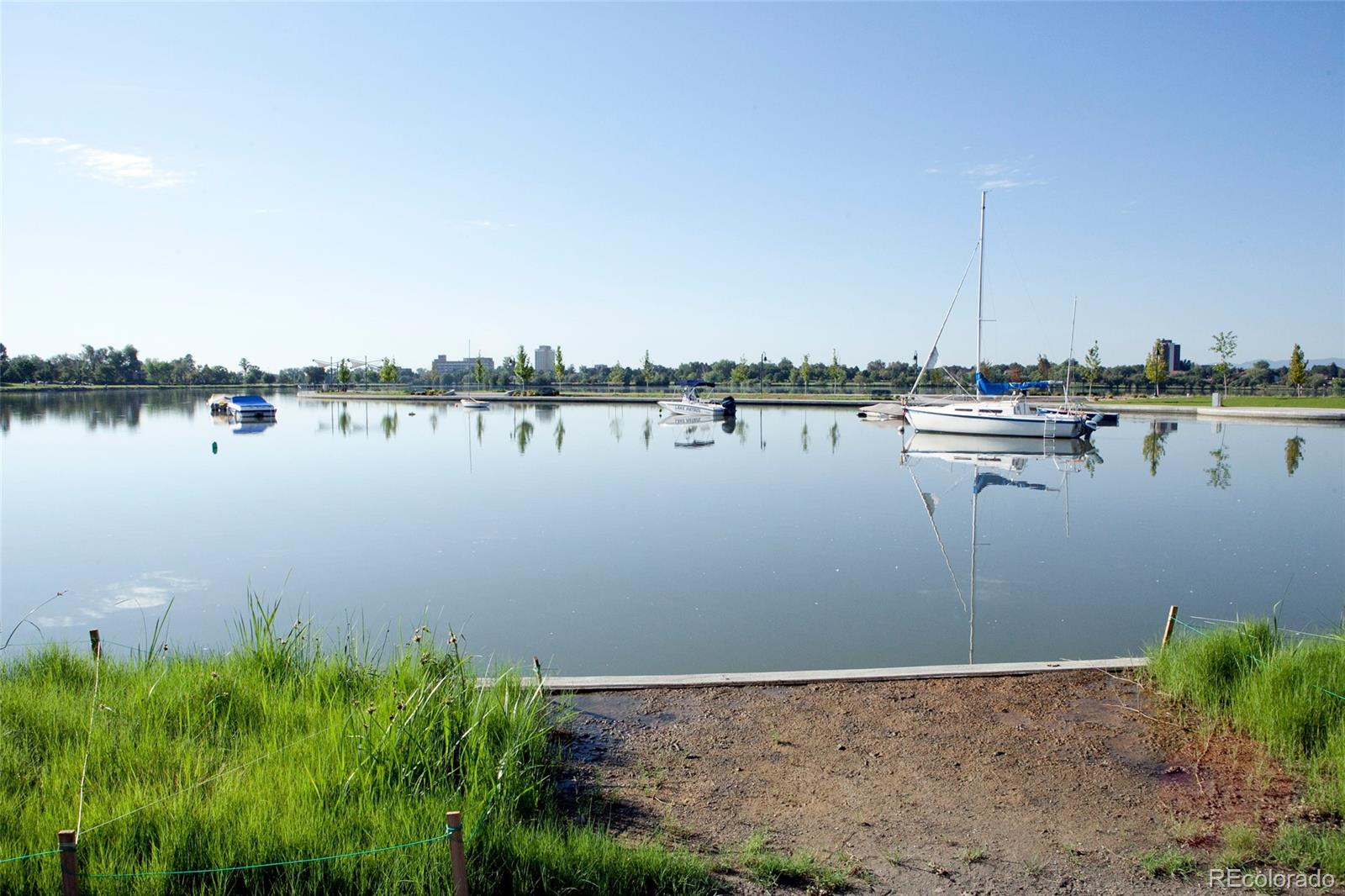965 Wolff Street, Unit A Denver, CO 80204 - Photo 30 of 34 a view of a lake with houses in the background