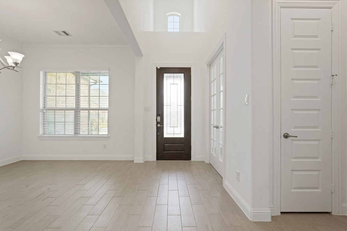 8010 Chantilly Manor Fulshear, TX 77441 - Photo 11 of 50 Welcome home to soaring ceilings and a handy coat closet by the front door.