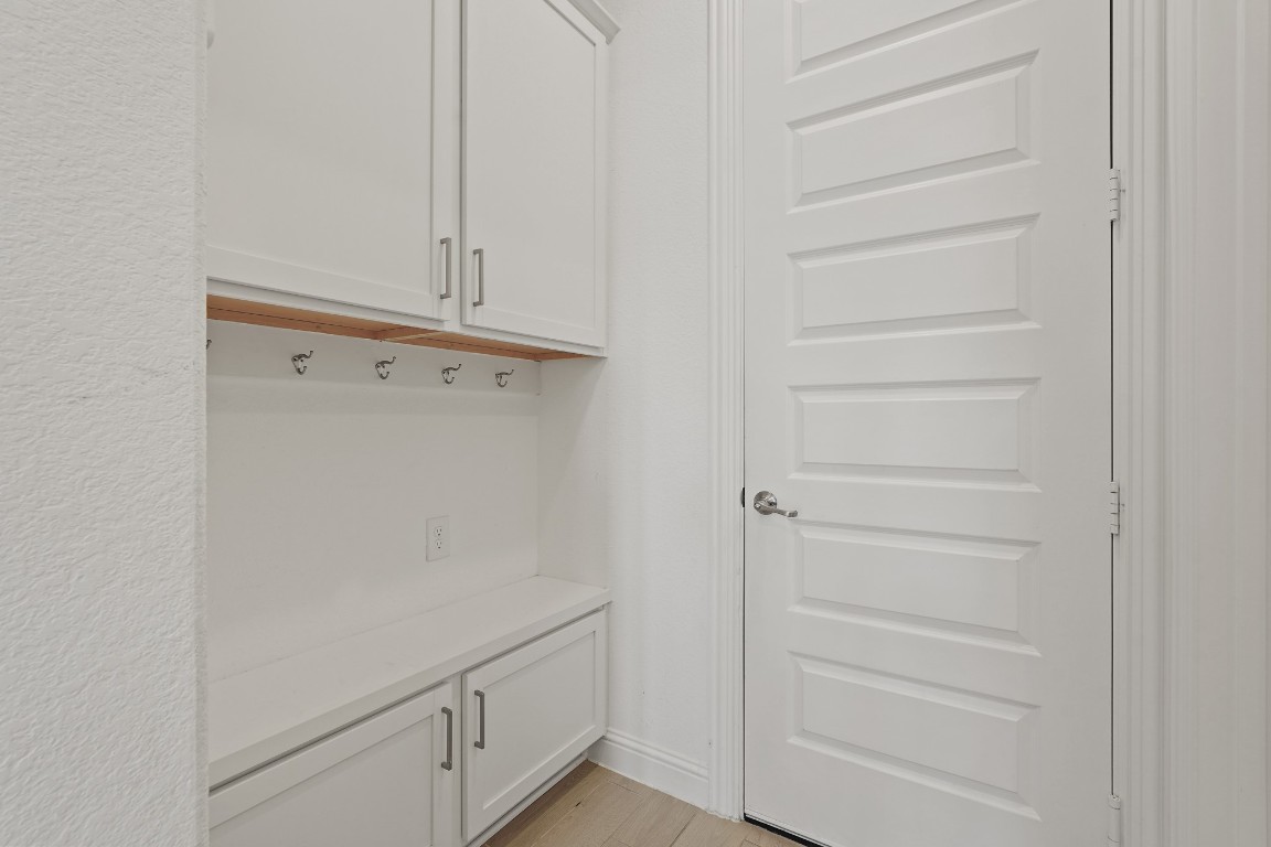 8010 Chantilly Manor Fulshear, TX 77441 - Photo 25 of 50 The mud area offers a convenient spot to hang backpacks and tuck shoes underneath upon entering from the garage
