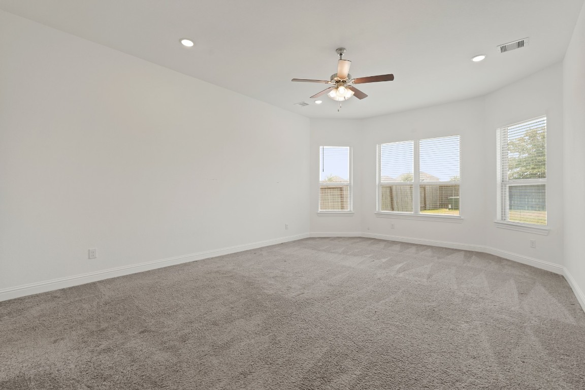 8010 Chantilly Manor Fulshear, TX 77441 - Photo 28 of 50 The primary room offers a spacious and comfortable retreat.