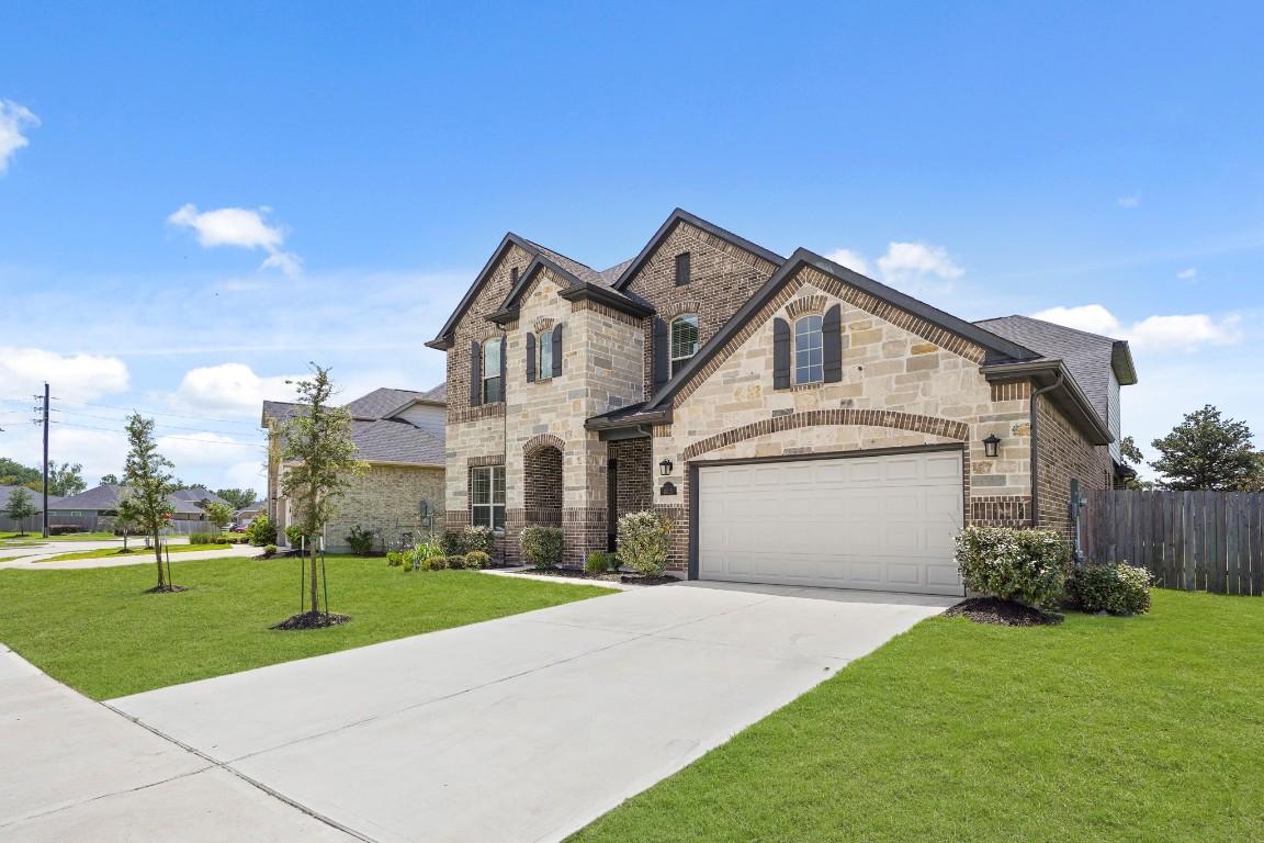 8010 Chantilly Manor Fulshear, TX 77441 - Photo 3 of 50 Beautiful front elevation with striking curb appeal.