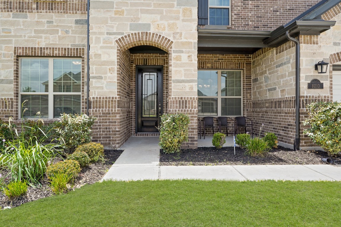 8010 Chantilly Manor Fulshear, TX 77441 - Photo 4 of 50 Charming front covered porch the perfect spot to start your day with a warm cup of coffee or tea!