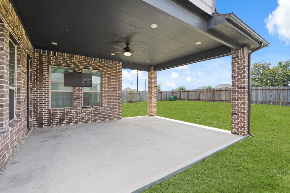 8010 Chantilly Manor Fulshear, TX 77441 - Photo 41 of 50 The extended covered patio includes a gas hose connection, perfect for outdoor grilling and entertaining.