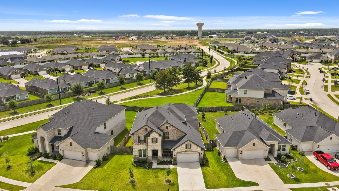8010 Chantilly Manor Fulshear, TX 77441 - Photo 45 of 50 Drone view of the home showcasing the full property layout and surrounding landscape