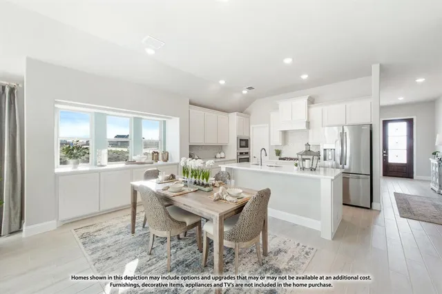 a living room with furniture a large window and wooden floor
