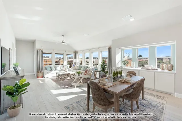 a living room with furniture dining area and a rug