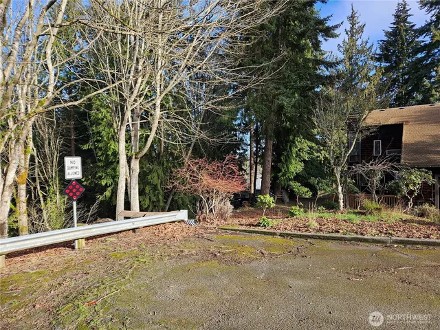 a view of a street with a building in the background