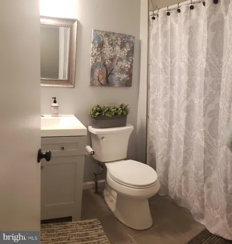 a bathroom with a toilet and a sink