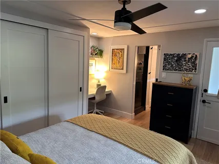 a bedroom with a bed and a walk in closet