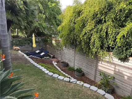 a backyard of a house with lots of green space