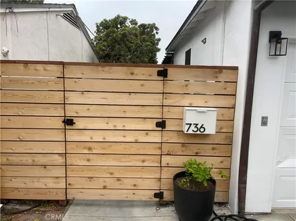 a view of a house with a potted plant