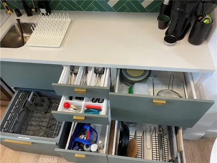 a utility room with dryer washer and other items