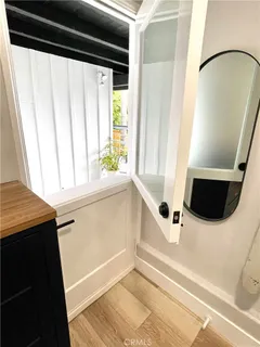 a view of a kitchen with a sink and microwave