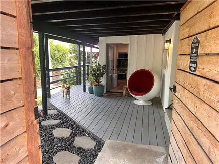 a view of balcony with wooden floor