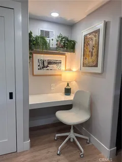 a workspace with furniture and a potted plant
