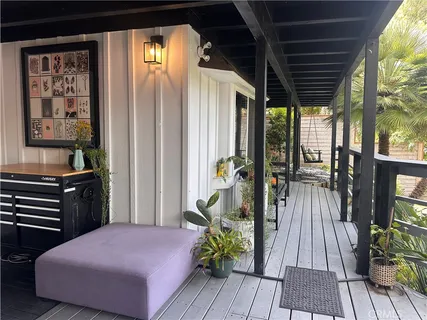 a bedroom with a bed and a balcony