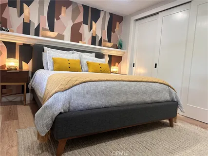 a bedroom with a bed and window