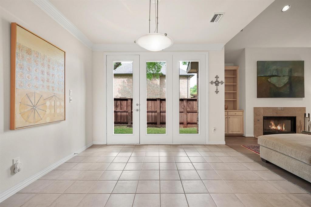 4209 Sexton Lane Dallas, TX 75229 - Photo 7 of 27 a view of an empty room with furniture and a fireplace