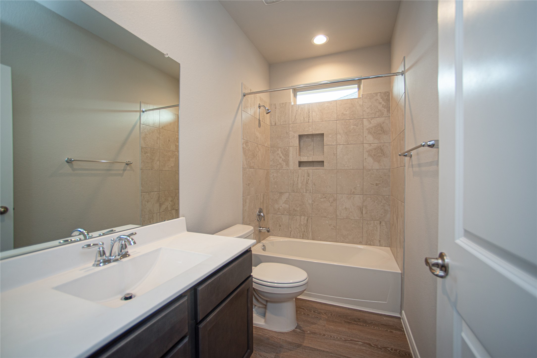439 Stonebrook Lane Conroe, TX 77304 - Photo 15 of 19 a bathroom with a sink toilet a mirror and shower