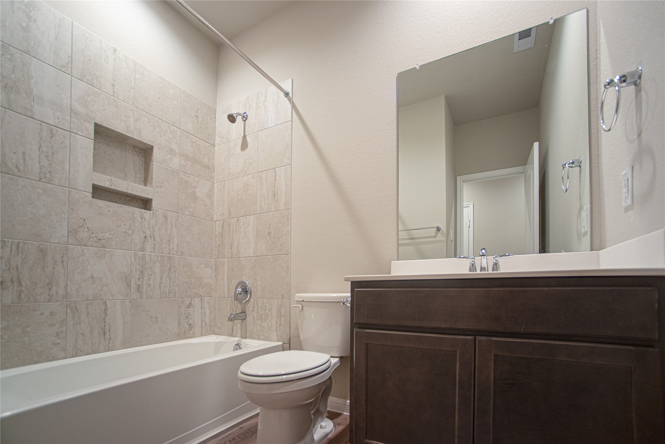 439 Stonebrook Lane Conroe, TX 77304 - Photo 16 of 19 a bathroom with a sink a toilet and shower