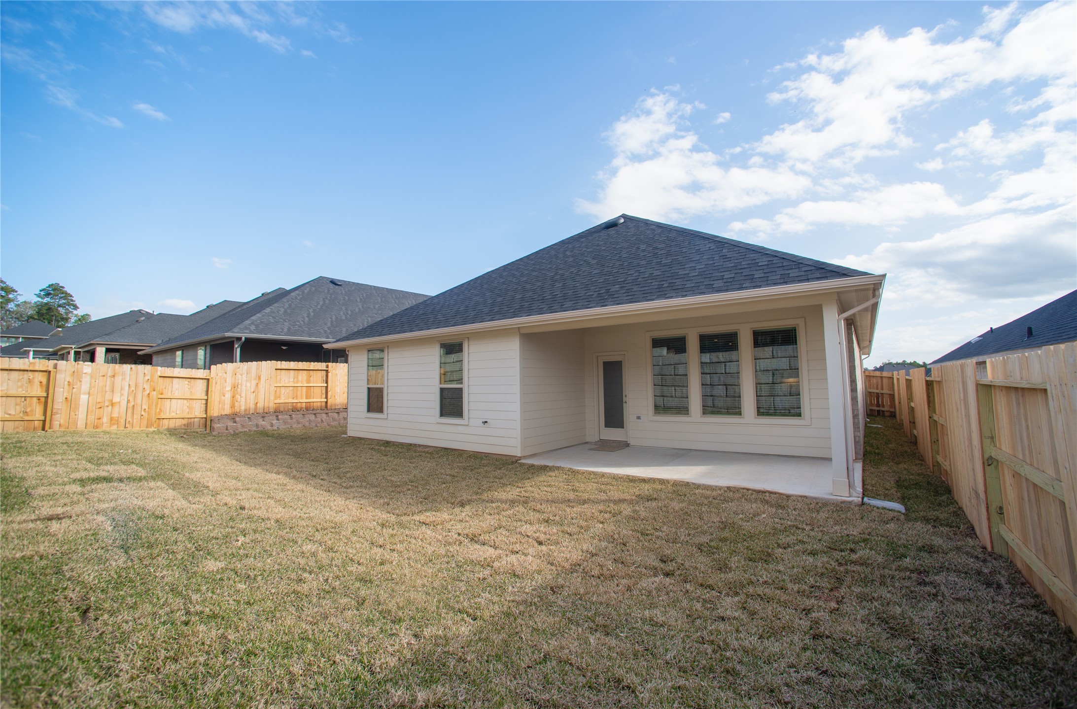 439 Stonebrook Lane Conroe, TX 77304 - Photo 19 of 19 a front view of a house with a yard and garage