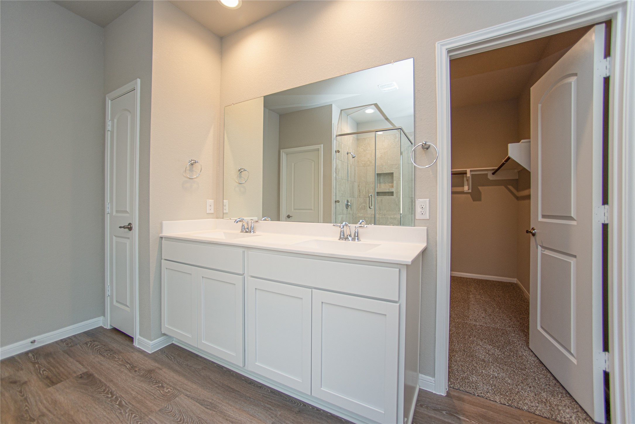 439 Stonebrook Lane Conroe, TX 77304 - Photo 10 of 19 a bathroom with a double vanity sink mirror and toilet