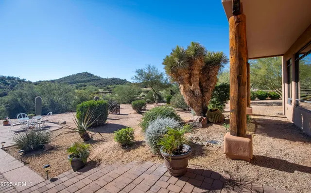 a view of a chairs and table in the patio