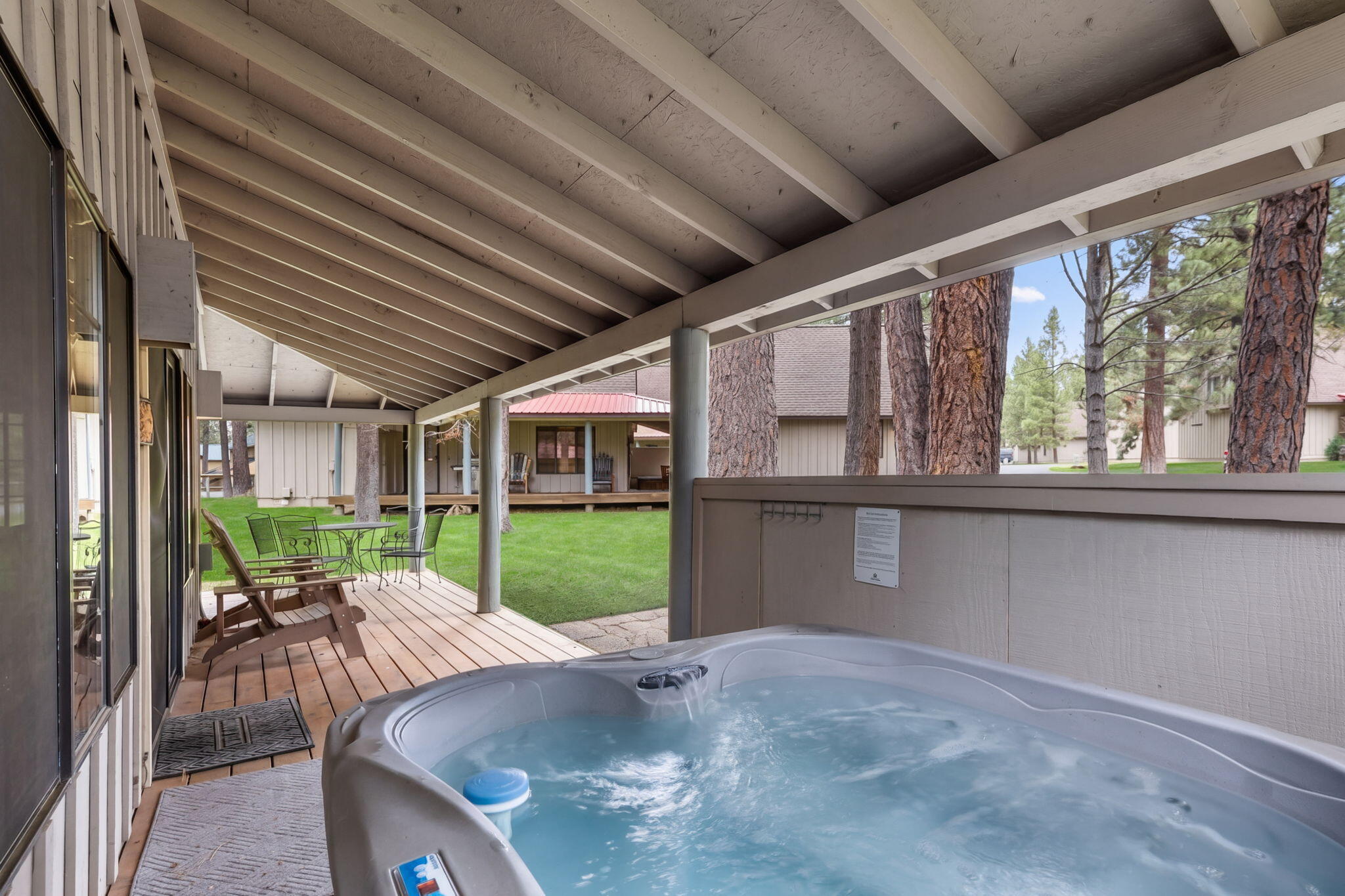 57505 Circle 4 Cabin Road, Unit 29 Sunriver, OR 97707 - Photo 6 of 35 a view of a porch with furniture and garden