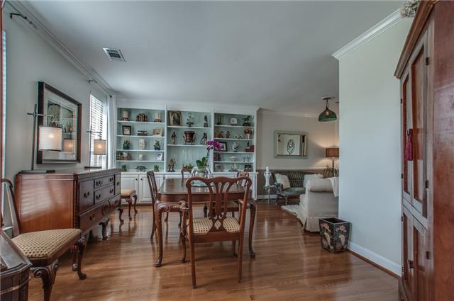 615 Gen George Patton Road Nashville, TN 37221 - Photo 5 of 20 L-shaped living room and dining room with built-ins. The owners are currently using the formal living room for their dining room.
