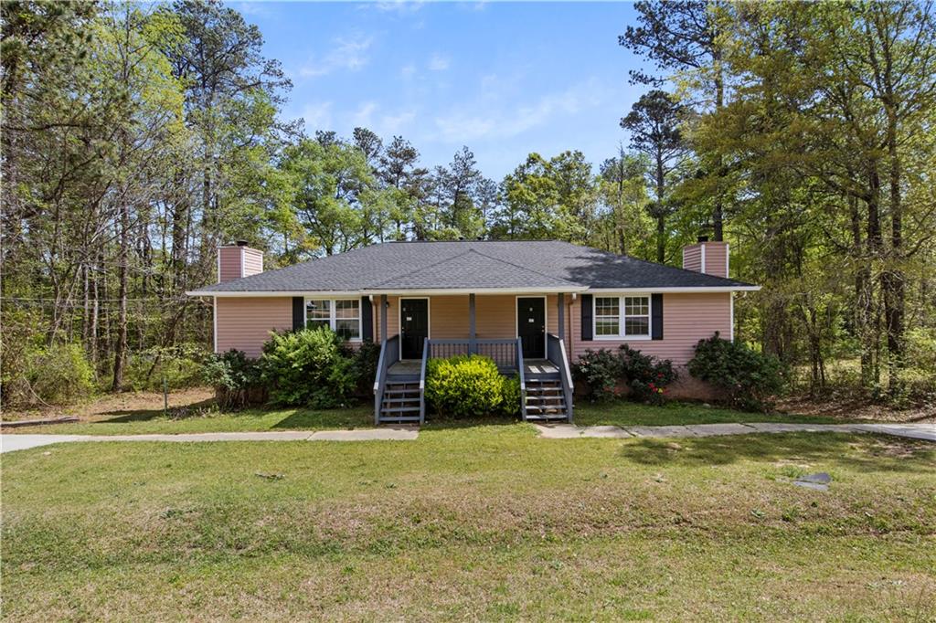 7756 Conners Road Winston, GA 30187 - Photo 1 of 1 a view of a yard in front of a house